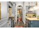 Bright kitchen with island, custom cabinetry, and access to dining area at 1391 Richmond Rd, Winter Park, FL 32789
