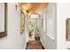 Bright hallway with arched doorways and an ornate rug at 1391 Richmond Rd, Winter Park, FL 32789