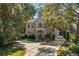 Brick home nestled in lush landscaping, large driveway at 1391 Richmond Rd, Winter Park, FL 32789
