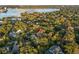 Aerial view of a house nestled in a lush, tree-lined neighborhood near Lake Virginia at 1391 Richmond Rd, Winter Park, FL 32789