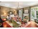 Luxurious main bedroom with a king-size bed and access to a private balcony at 1391 Richmond Rd, Winter Park, FL 32789
