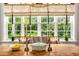 Sunlit breakfast nook with wood table, creating a warm atmosphere at 1391 Richmond Rd, Winter Park, FL 32789