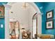 Grand entryway with arched doorways and a unique chandelier at 1391 Richmond Rd, Winter Park, FL 32789