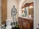 Unique bathroom with antique vanity and knight-themed wall art at 1391 Richmond Rd, Winter Park, FL 32789