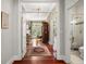 Hallway with hardwood floors, access to bedroom and bathroom at 1391 Richmond Rd, Winter Park, FL 32789