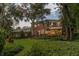 Brick house with a large backyard and mature trees at 1391 Richmond Rd, Winter Park, FL 32789