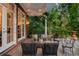 Elegant covered patio with comfortable seating and views of the garden at 1391 Richmond Rd, Winter Park, FL 32789