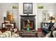 Elegant living room with fireplace, hardwood floors, and stylish furnishings at 1391 Richmond Rd, Winter Park, FL 32789