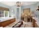 Spa-like bathroom with soaking tub, double vanity, and walk-in shower at 1391 Richmond Rd, Winter Park, FL 32789