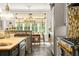 Spacious kitchen with island, breakfast nook, and view of backyard at 1391 Richmond Rd, Winter Park, FL 32789