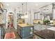 Open kitchen with island, custom cabinetry, and access to dining area at 1391 Richmond Rd, Winter Park, FL 32789