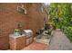 Brick outdoor kitchen with grill and patio seating area at 1391 Richmond Rd, Winter Park, FL 32789