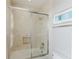 Bathroom with tub, shower, and updated fixtures at 2602 Sunrise Shores Dr, Kissimmee, FL 34747