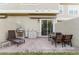 Outdoor patio with built-in grill, dining area, and lounge chair at 2602 Sunrise Shores Dr, Kissimmee, FL 34747