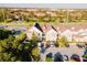 Aerial view of townhouses with ample parking and landscaping at 2602 Sunrise Shores Dr, Kissimmee, FL 34747