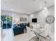 Open concept living room with modern furniture and a large TV at 2602 Sunrise Shores Dr, Kissimmee, FL 34747