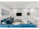 Modern living room with blue sectional sofa and glass coffee table at 2602 Sunrise Shores Dr, Kissimmee, FL 34747