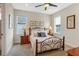 Bright bedroom with a comfortable bed and charming nightstands at 501 N Dillard St, Winter Garden, FL 34787