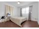 Bright bedroom with wood-look floors and neutral decor at 104 E Mcclendon St, Lady Lake, FL 32159