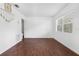 Spacious living room with wood-look floors and large windows at 104 E Mcclendon St, Lady Lake, FL 32159