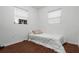 Cozy bedroom with wood-look floors and ample natural light at 104 E Mcclendon St, Lady Lake, FL 32159