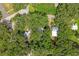 Aerial view showing home's location in a wooded area at 104 E Mcclendon St, Lady Lake, FL 32159