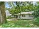 One story house with carport and green door at 104 E Mcclendon St, Lady Lake, FL 32159