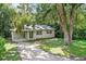 One story house with carport and green door at 104 E Mcclendon St, Lady Lake, FL 32159
