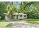 One story house with carport and green door at 104 E Mcclendon St, Lady Lake, FL 32159