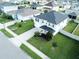 Two-story house with gray siding, black roof, and a well-manicured lawn at 2346 Upland Ln, Apopka, FL 32712
