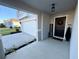 Front entrance with dark door, welcome sign, and seasonal decor at 2346 Upland Ln, Apopka, FL 32712
