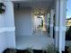 Front porch with rocking chairs, white columns, and landscaping at 2346 Upland Ln, Apopka, FL 32712