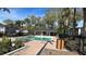 Community pool with surrounding landscaping at 7622 Forest City Rd # E, Orlando, FL 32810