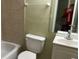 Clean bathroom with a toilet, sink, and bathtub at 7622 Forest City Rd # E, Orlando, FL 32810
