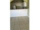 Kitchen with white cabinets and a breakfast bar at 7622 Forest City Rd # E, Orlando, FL 32810