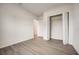 Simple bedroom with vinyl flooring and a double door closet at 1308 Hillsborough Ct, Kissimmee, FL 34759
