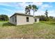 Exterior view of house with light gray siding at 1308 Hillsborough Ct, Kissimmee, FL 34759