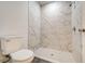 Clean bathroom with marble shower and toilet at 1308 Hillsborough Ct, Kissimmee, FL 34759