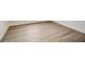 Light brown wood-look vinyl flooring at 1308 Hillsborough Ct, Kissimmee, FL 34759