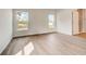 Bedroom with wood-look flooring and access to bathroom at 1308 Hillsborough Ct, Kissimmee, FL 34759