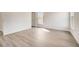 Bright bedroom with light wood-look flooring and neutral walls at 1308 Hillsborough Ct, Kissimmee, FL 34759