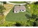 Aerial view of a house with a large backyard at 1308 Hillsborough Ct, Kissimmee, FL 34759