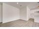 Simple dining area with white walls and light wood floors at 1308 Hillsborough Ct, Kissimmee, FL 34759