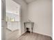 Bright laundry room with a utility sink and modern flooring at 1308 Hillsborough Ct, Kissimmee, FL 34759