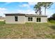 Exterior view of house with light gray siding at 1308 Hillsborough Ct, Kissimmee, FL 34759