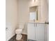 Clean bathroom with white vanity, quartz countertop and modern fixtures at 1308 Hillsborough Ct, Kissimmee, FL 34759