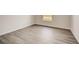 Light brown wood-look vinyl flooring at 1308 Hillsborough Ct, Kissimmee, FL 34759