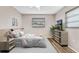 Comfortable bedroom with a queen bed and wood-look flooring at 106 Oregon Ave, Saint Cloud, FL 34769