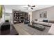 Spacious living room featuring built-in bookshelves and a cozy seating area at 106 Oregon Ave, Saint Cloud, FL 34769