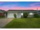 Charming ranch-style home with a well-manicured lawn at 106 Oregon Ave, Saint Cloud, FL 34769